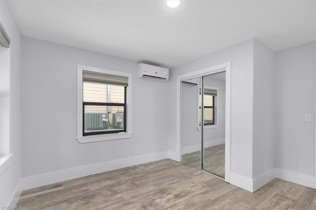 3240 Collee Court Naples, FL 34112 - Photo 12 of 42 an empty room with windows and closet