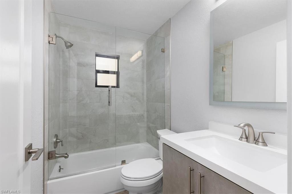 3240 Collee Court Naples, FL 34112 - Photo 13 of 42 a bathroom with a sink toilet and shower