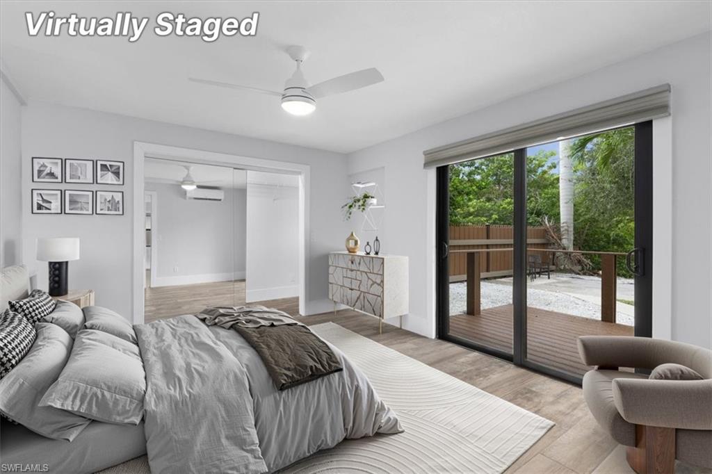 3240 Collee Court Naples, FL 34112 - Photo 19 of 42 a bedroom with furniture and a large window