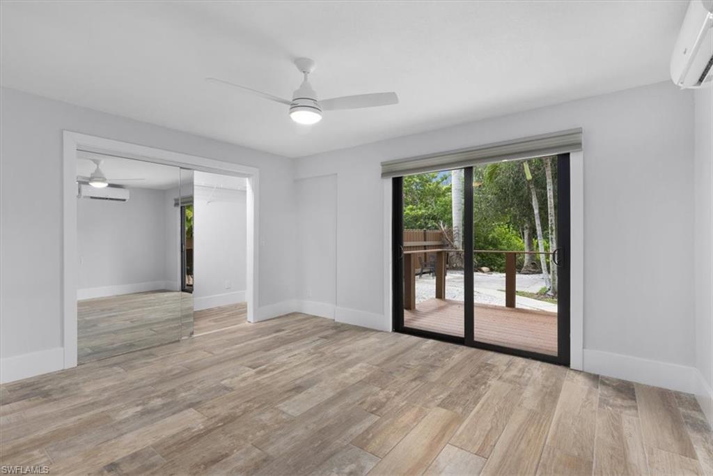 3240 Collee Court Naples, FL 34112 - Photo 22 of 42 a view of an empty room with glass door and balcony