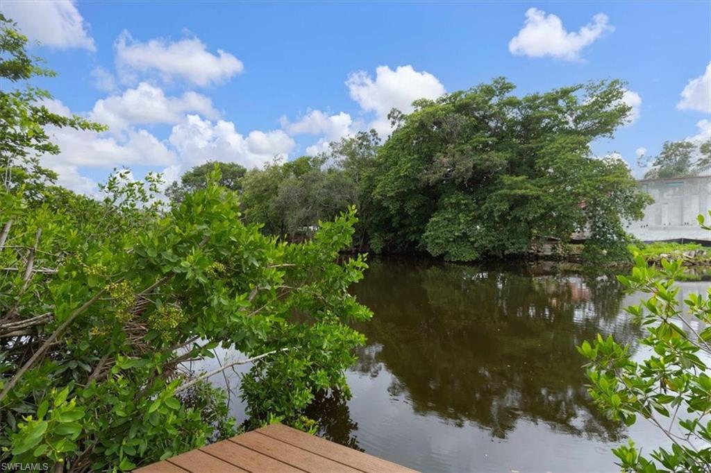 3240 Collee Court Naples, FL 34112 - Photo 33 of 42 a view of a lake with houses