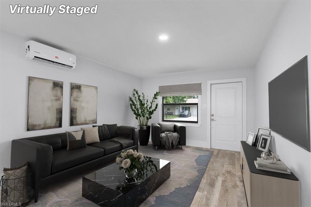 3240 Collee Court Naples, FL 34112 - Photo 5 of 42 a living room with furniture and a flat screen tv