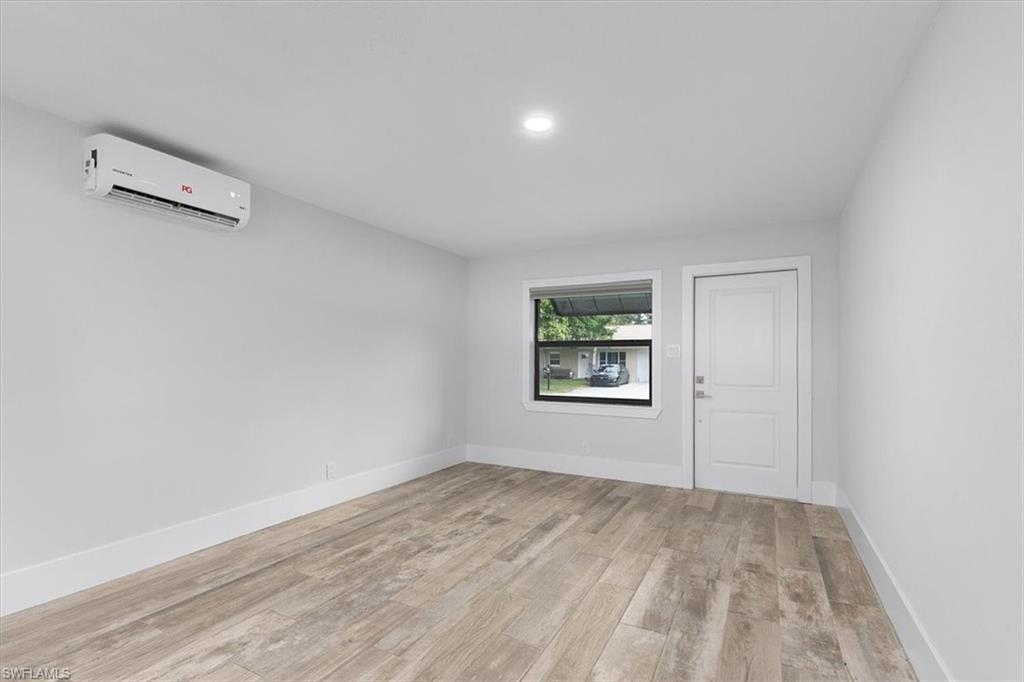 3240 Collee Court Naples, FL 34112 - Photo 6 of 42 an empty room with a window