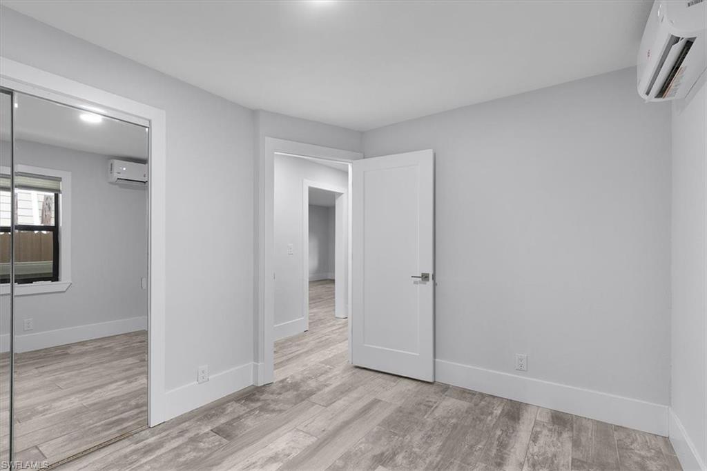 3240 Collee Court Naples, FL 34112 - Photo 9 of 42 wooden floor in an empty room