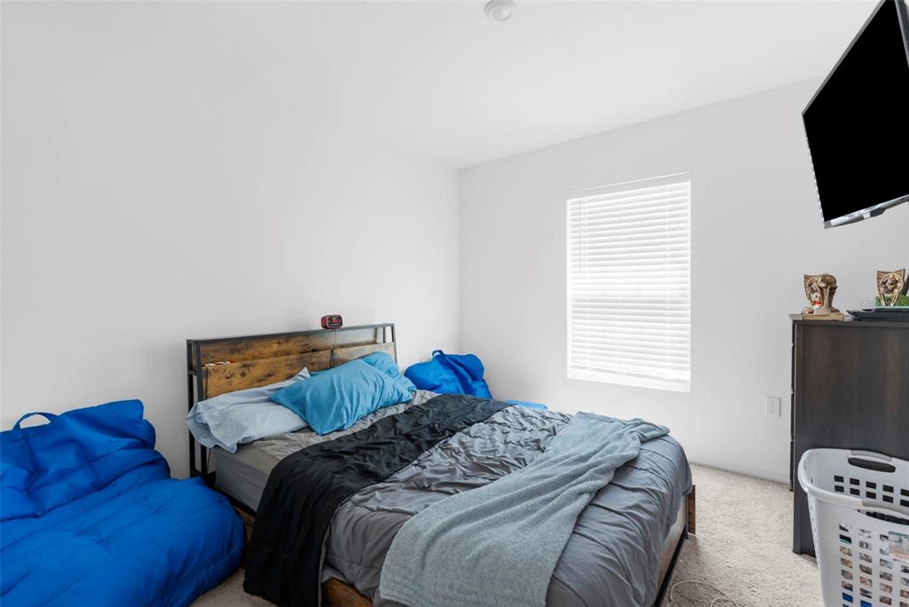 5637 East Tangelo Lane Inverness, FL 34453 - Photo 16 of 23 a bedroom with a bed and a television