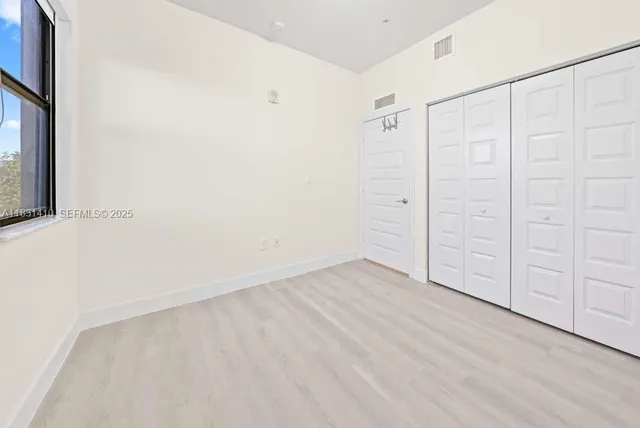 a bathroom with a sink a toilet and a large mirror