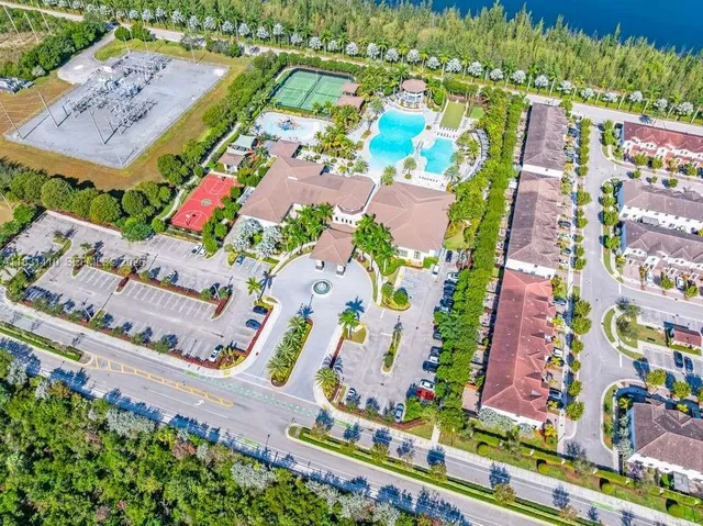 a view of a house with pool garden and plants