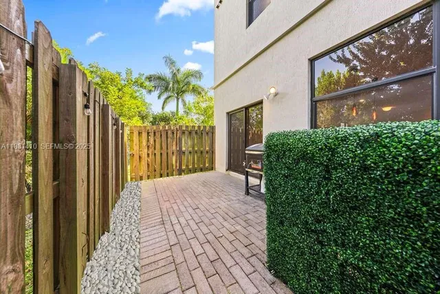 a bedroom with a bed and a wooden floor