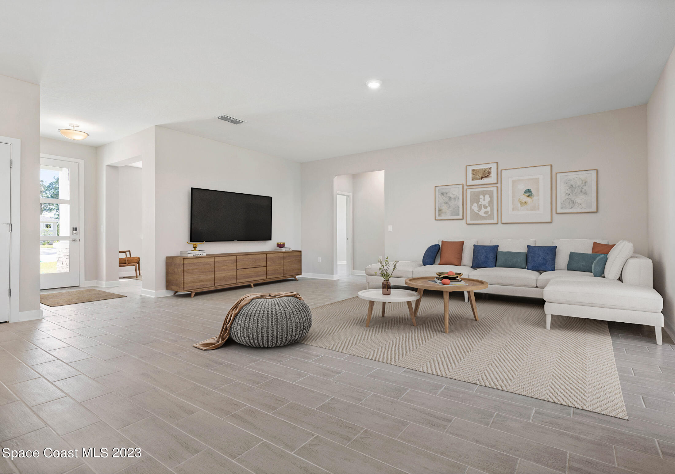 407 Hallcrest Street Palm Bay, FL 32908 - Photo 6 of 25 a living room with furniture and a flat screen tv