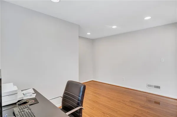 a view of workspace with wooden floor