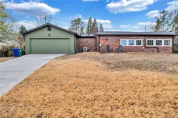 front view of a house with a yard