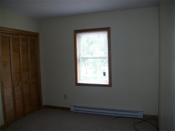 146 Brookside Road Orange, MA 01364 - Photo 7 of 9 an empty room with a window