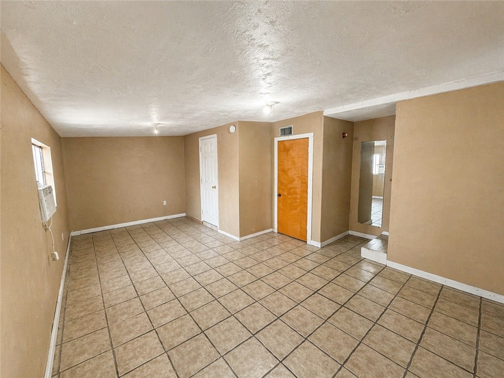 403 Staples Street Alice, TX 78332 - Photo 11 of 15 a view of an empty room and window
