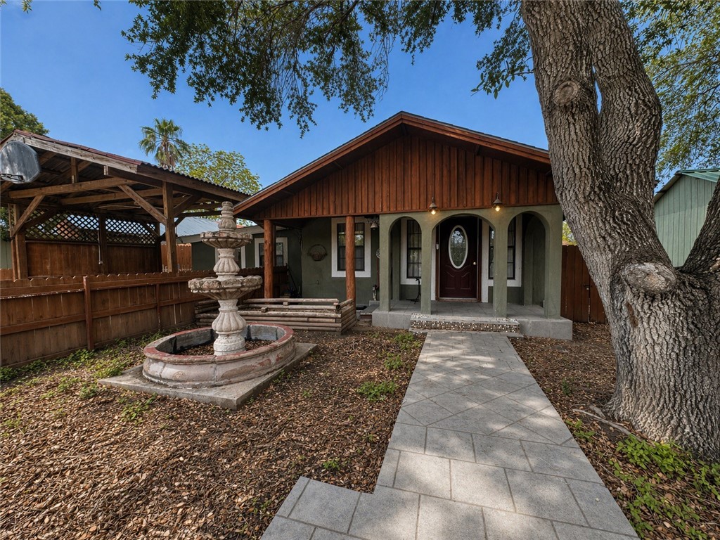 403 Staples Street Alice, TX 78332 - Photo 2 of 15 a view of a house with a yard siting and a patio