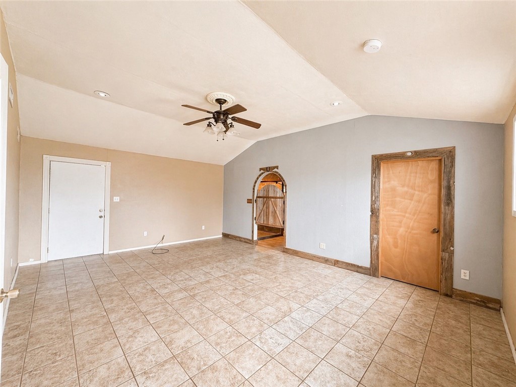 403 Staples Street Alice, TX 78332 - Photo 5 of 15 a view of empty room with a ceiling fan