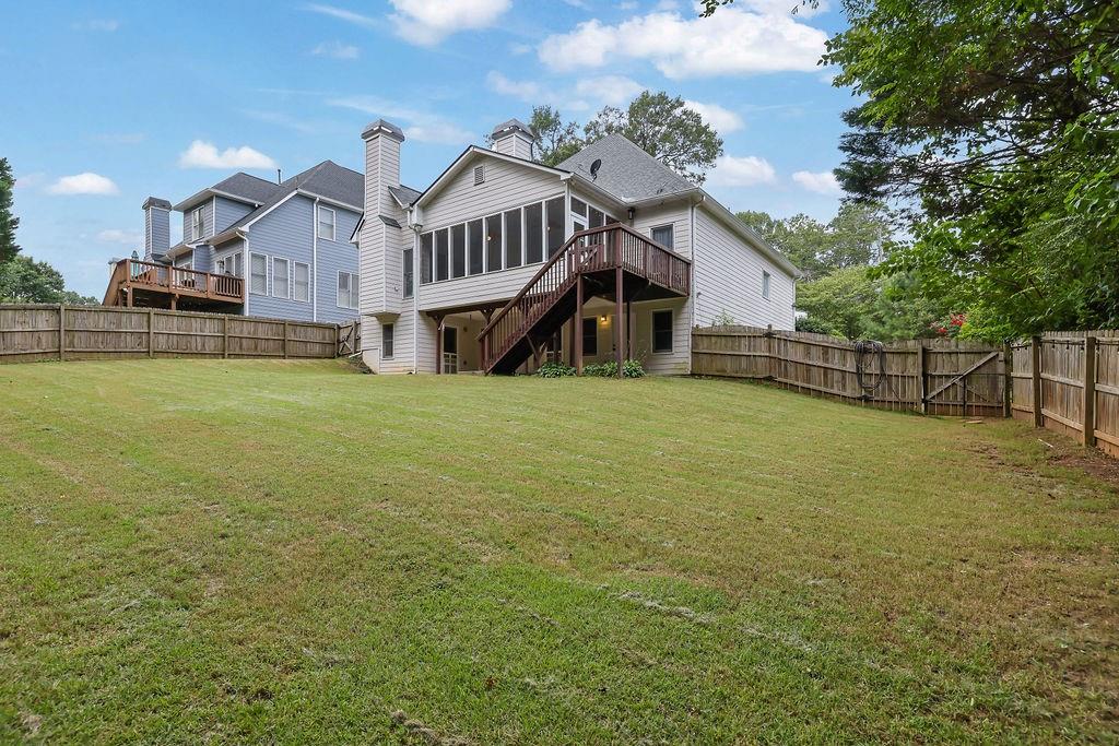 1978 New Kemp Road Marietta, GA 30066 - Photo 41 of 45 a view of a house with a big yard and large trees