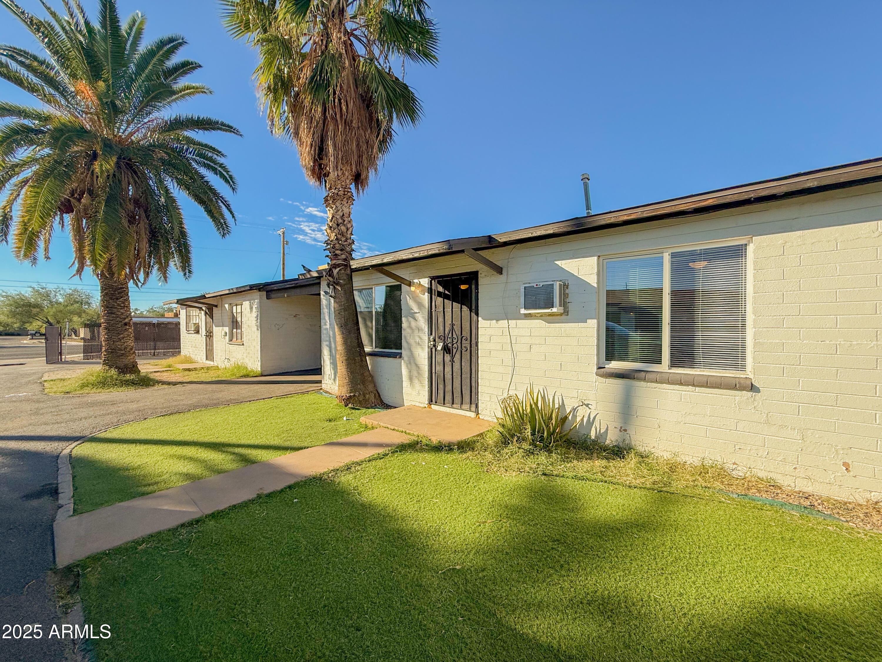 2 East Navajo Road, Unit E Tucson, AZ 85705 - Photo 1 of 15 a house with swimming pool in front of it