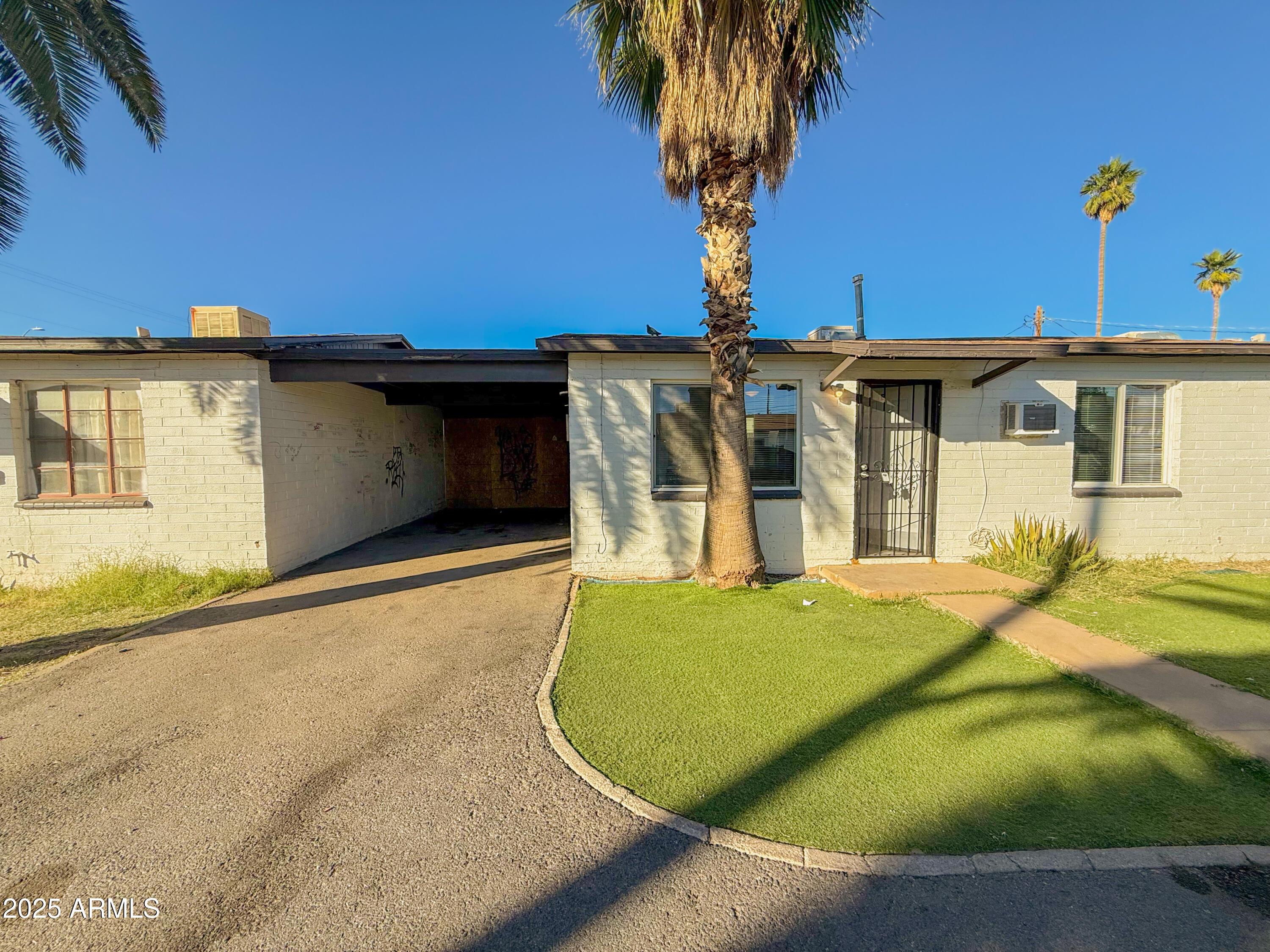 2 East Navajo Road, Unit E Tucson, AZ 85705 - Photo 3 of 15 a view of a house with a backyard