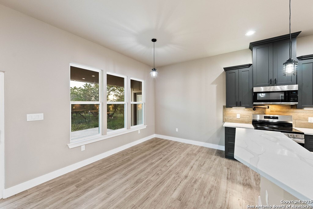 502 Sumack Kerrville, TX 78028 - Photo 12 of 58 a view of a kitchen with a sink stove and cabinet