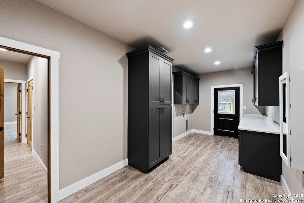 502 Sumack Kerrville, TX 78028 - Photo 33 of 58 a view of hallway with stairs and wooden floor