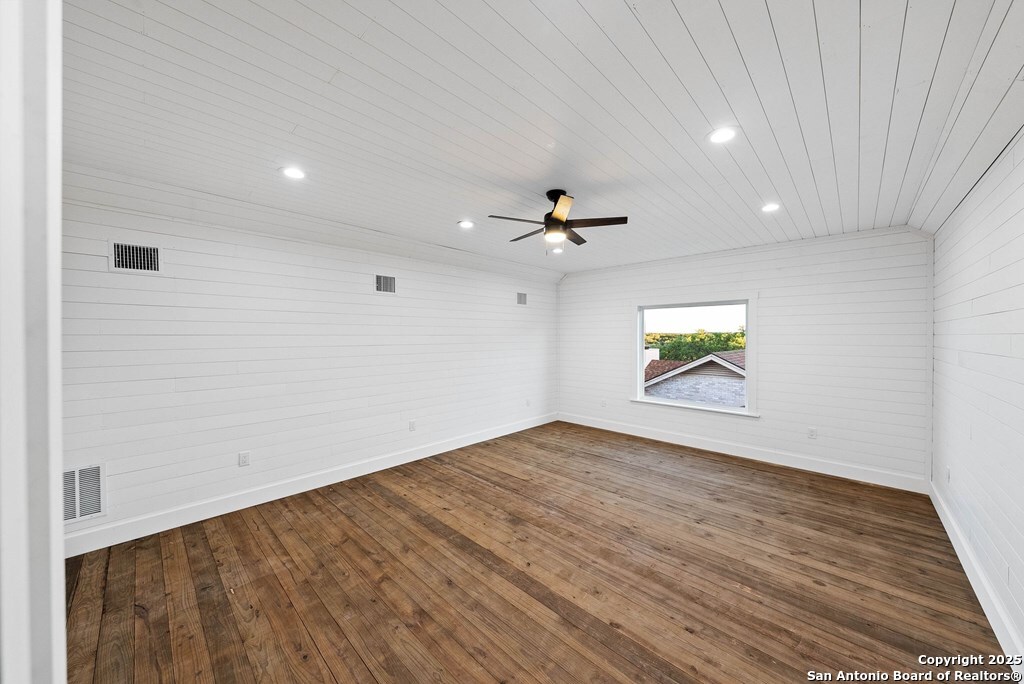 502 Sumack Kerrville, TX 78028 - Photo 38 of 58 wooden floor in an empty room with a window
