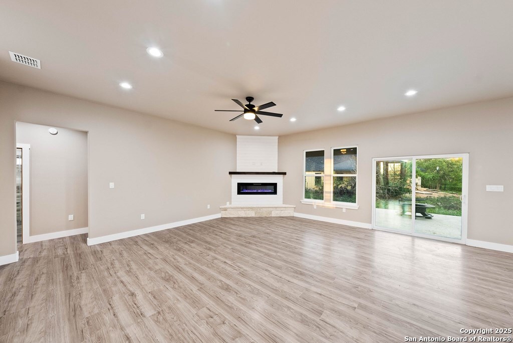 502 Sumack Kerrville, TX 78028 - Photo 4 of 58 a view of livingroom with hardwood floor and a ceiling fan