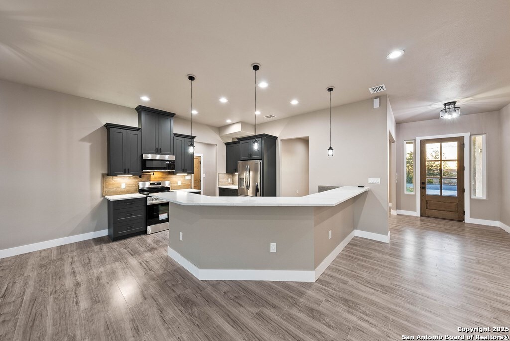 502 Sumack Kerrville, TX 78028 - Photo 7 of 58 a living room with stainless steel appliances furniture large kitchen view and living room