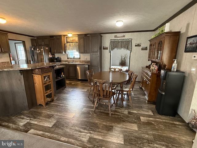 14 Egret Drive Hanover, PA 17331 - Photo 13 of 30 a kitchen with stainless steel appliances granite countertop a refrigerator a stove a sink a dining table and chairs with wooden floor