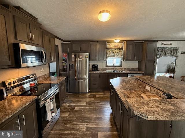 14 Egret Drive Hanover, PA 17331 - Photo 7 of 30 a kitchen with granite countertop kitchen island stainless steel appliances a refrigerator stove top oven and sink