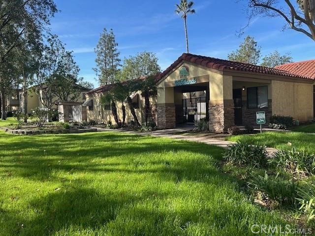 1110 West Blaine Street, Unit 107 Riverside, CA 92507 - Photo 22 of 32 Clubhouse and Entrance to Pool Area