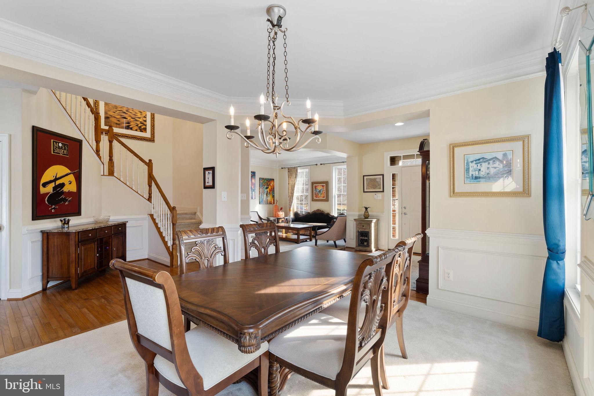 5102 Hugunin Way Perry Hall, MD 21128 - Photo 11 of 45 a dining room with furniture a chandelier and wooden floor