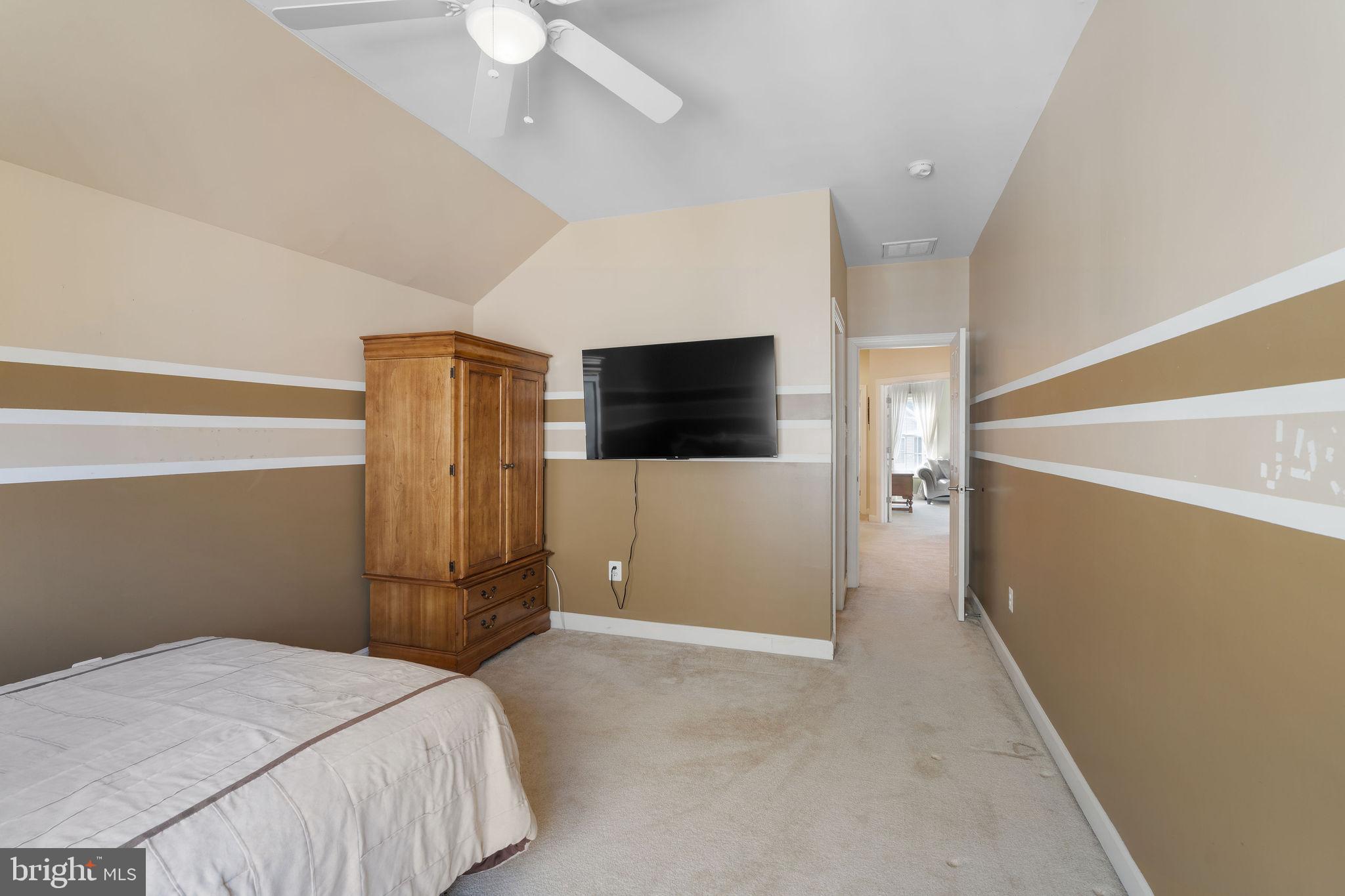 5102 Hugunin Way Perry Hall, MD 21128 - Photo 31 of 45 a bedroom with a bed and a flat screen tv