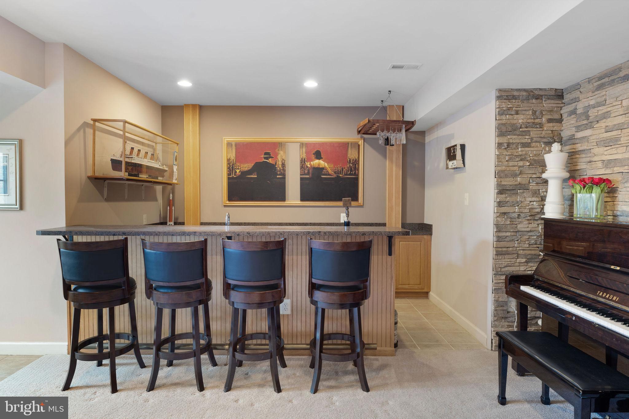 5102 Hugunin Way Perry Hall, MD 21128 - Photo 36 of 45 a dinning room with stainless steel appliances kitchen island granite countertop furniture and a fireplace