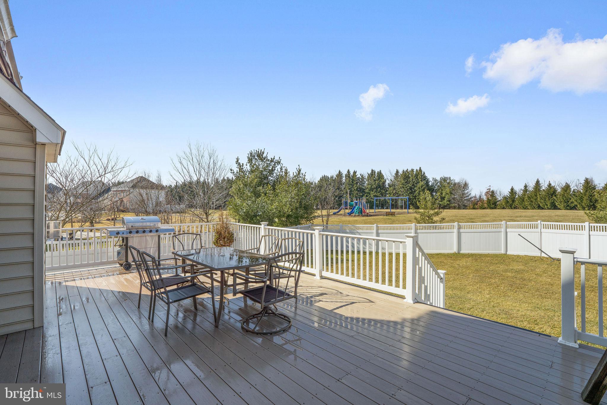 5102 Hugunin Way Perry Hall, MD 21128 - Photo 41 of 45 a view of a balcony with furniture and wooden floor