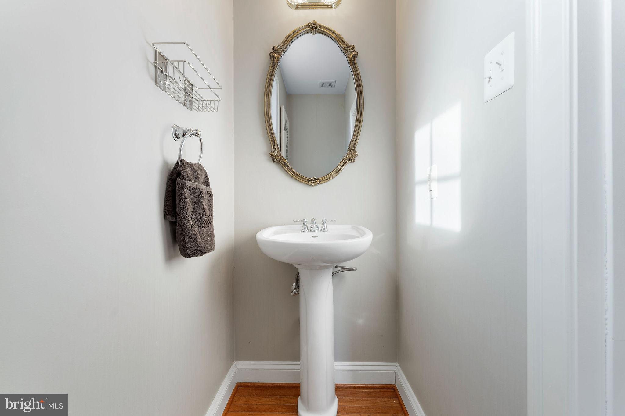 5102 Hugunin Way Perry Hall, MD 21128 - Photo 9 of 45 a bathroom with a sink and a mirror