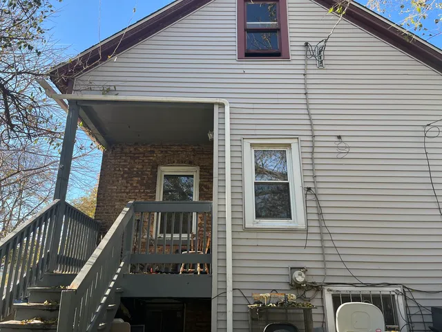 a front view of a house with stairs