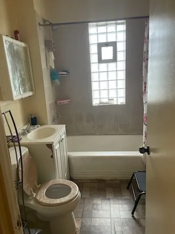a bathroom with a sink toilet and bathtub