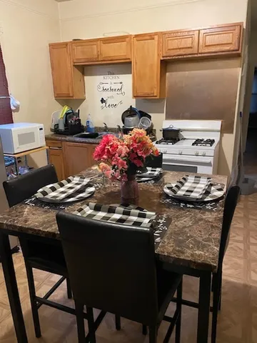 a kitchen with a stove and a refrigerator