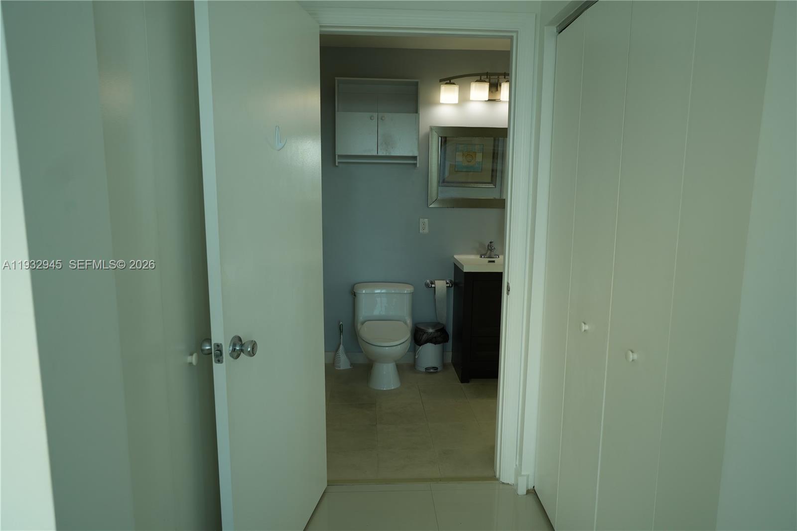 60 Southwest 13th Street, Unit 1901 Miami, FL 33130 - Photo 11 of 17 a bathroom with a toilet