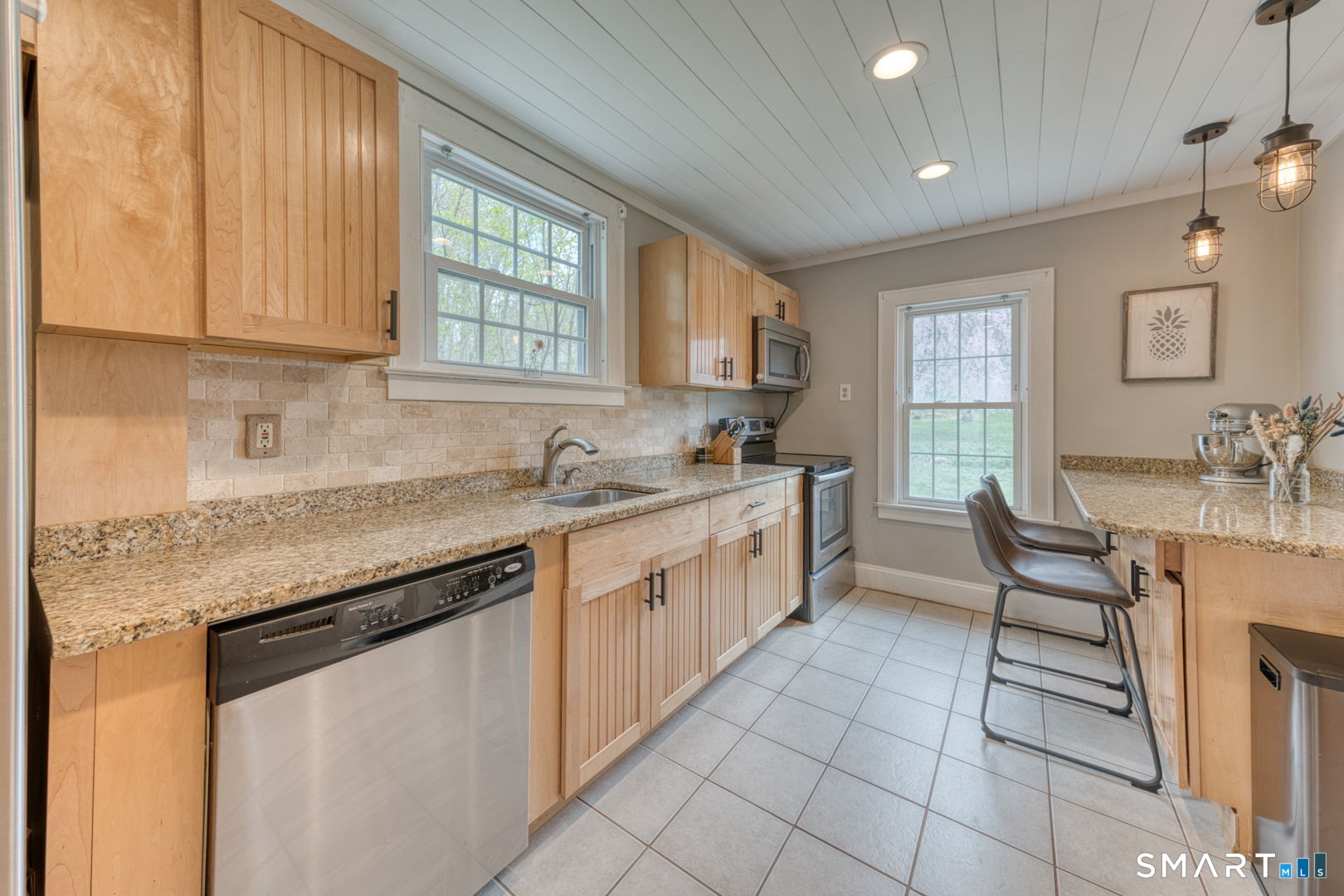 112 Fitzgerald Boulevard Coventry, CT 06238 - Photo 11 of 25 a kitchen with a sink window and cabinets