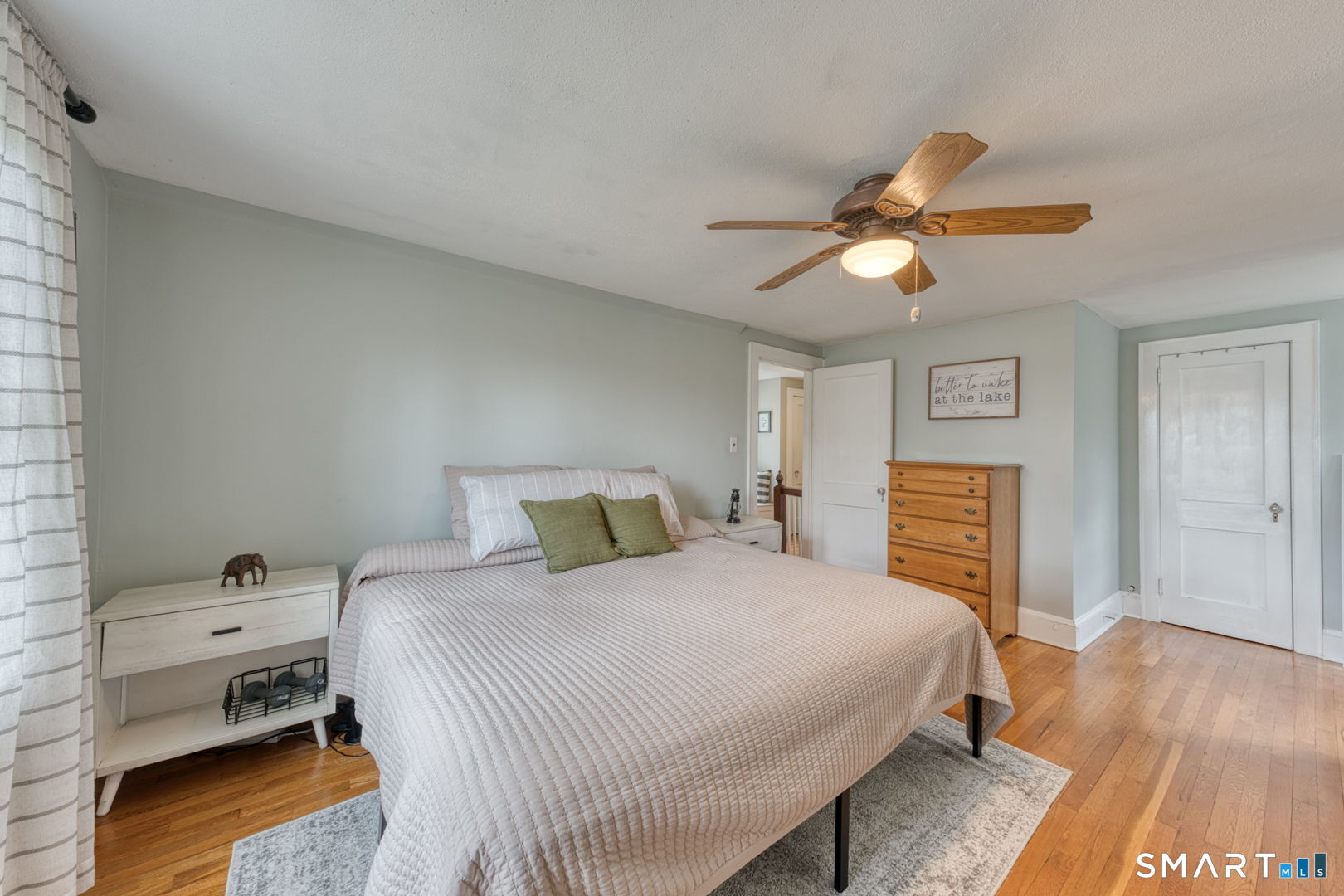 112 Fitzgerald Boulevard Coventry, CT 06238 - Photo 17 of 25 a bedroom with a bed and a chandelier