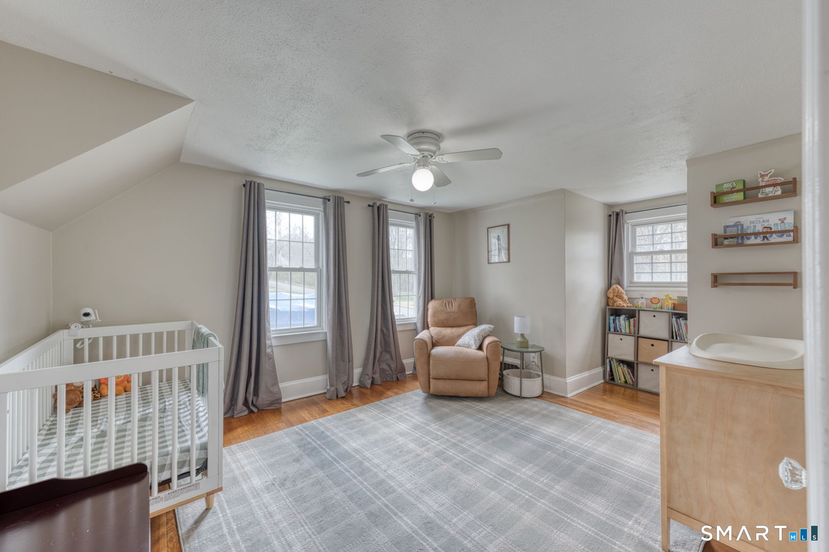 112 Fitzgerald Boulevard Coventry, CT 06238 - Photo 18 of 25 a living room with furniture and a baby crib