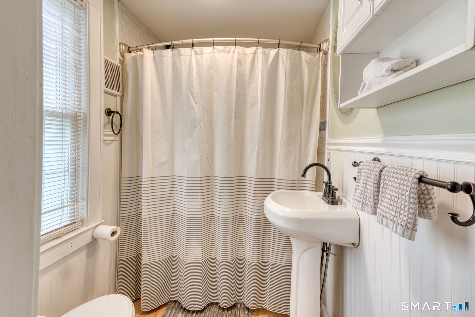 112 Fitzgerald Boulevard Coventry, CT 06238 - Photo 20 of 25 a bathroom with a sink and mirror