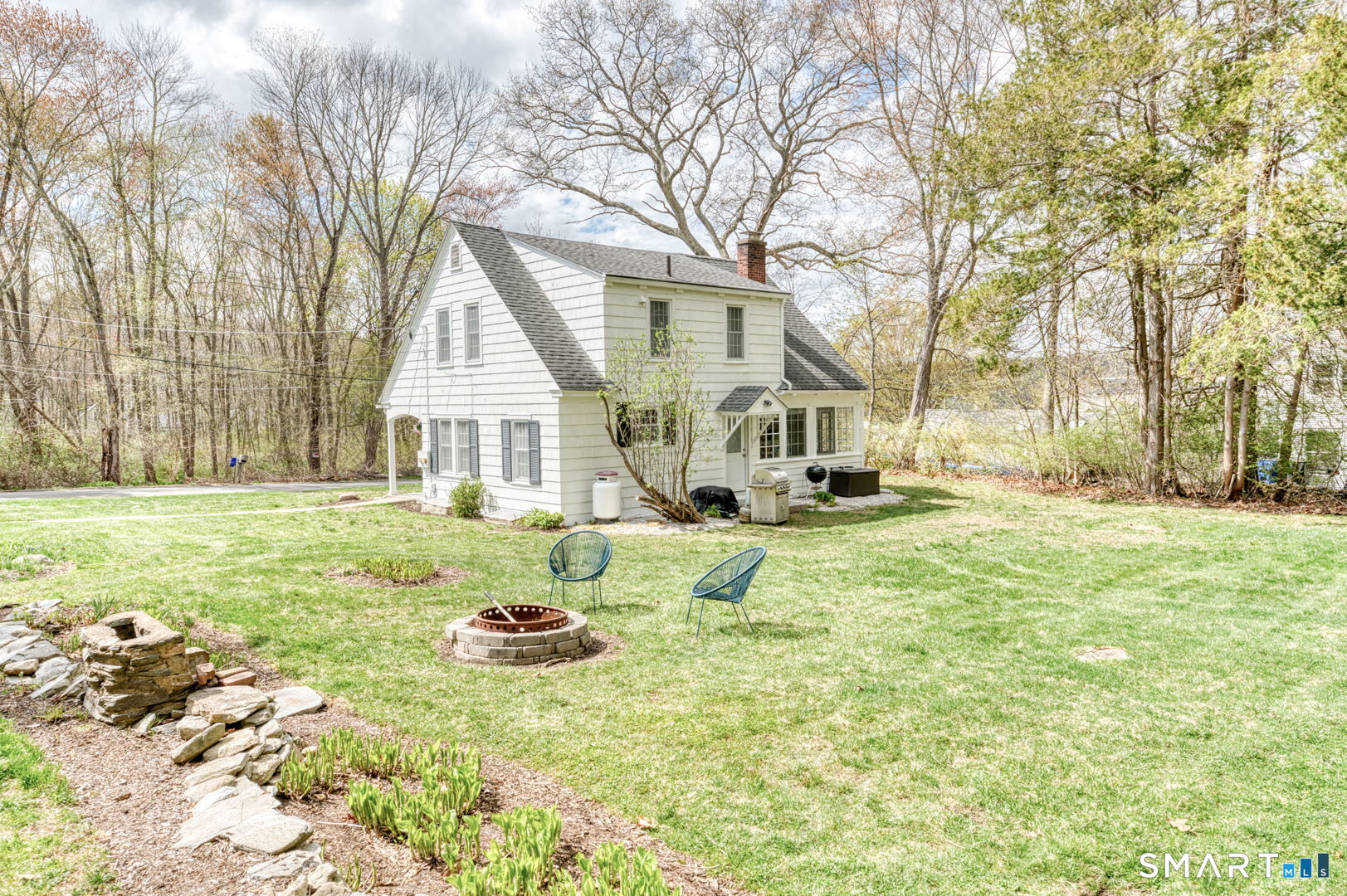 112 Fitzgerald Boulevard Coventry, CT 06238 - Photo 2 of 25 a house that has a tree in the grass