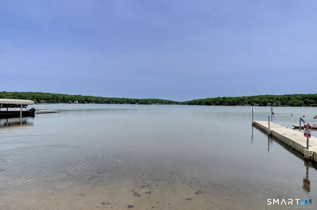 112 Fitzgerald Boulevard Coventry, CT 06238 - Photo 25 of 25 a view of lake with city and trees in the background