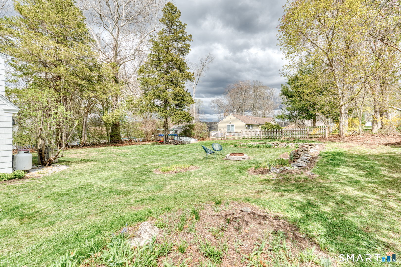 112 Fitzgerald Boulevard Coventry, CT 06238 - Photo 3 of 25 a view of yard with trees