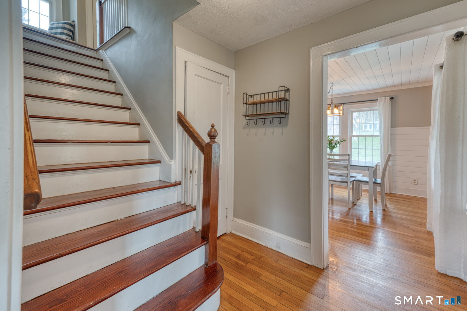 112 Fitzgerald Boulevard Coventry, CT 06238 - Photo 6 of 25 a view of a hallway with wooden floor and staircase