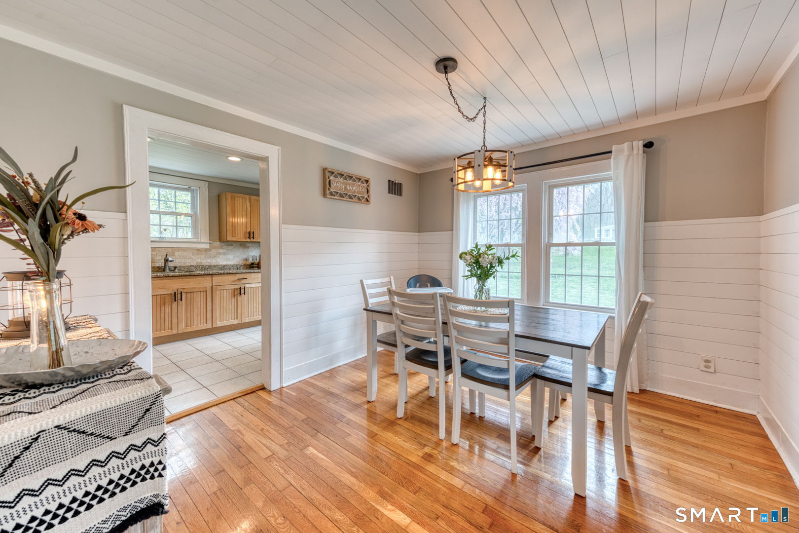 112 Fitzgerald Boulevard Coventry, CT 06238 - Photo 9 of 25 a view of a dining room with furniture window and wooden floor