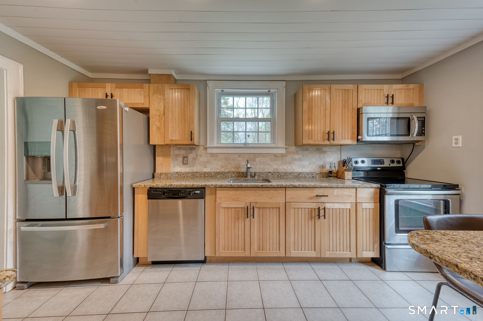 112 Fitzgerald Boulevard Coventry, CT 06238 - Photo 10 of 25 a kitchen with granite countertop a refrigerator stove top oven and sink