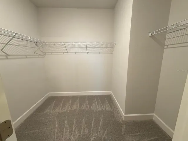 a view of a room with racks on the wall